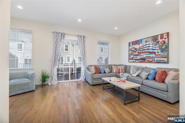 living room with recessed lighting and wood finished floors