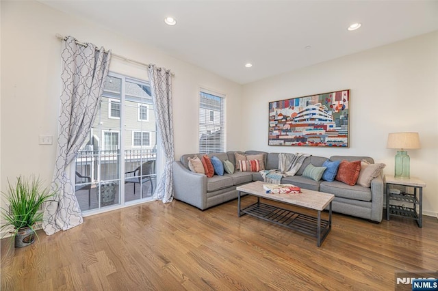 living room featuring recessed lighting and wood finished floors