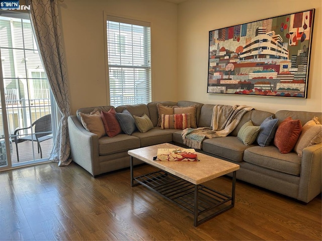 living room with a healthy amount of sunlight and wood finished floors