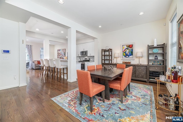 dining area featuring recessed lighting, baseboards, and dark wood-style floors