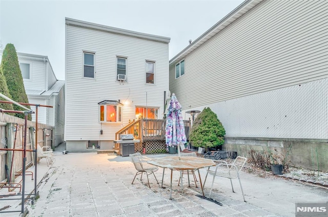 view of patio / terrace with outdoor dining area, fence, and grilling area