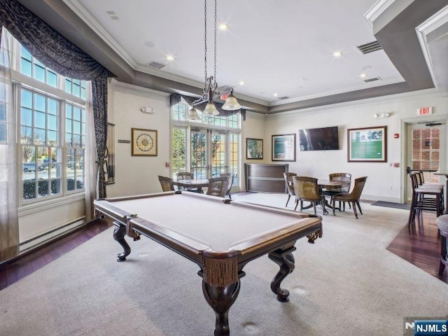 playroom with visible vents, baseboard heating, and crown molding