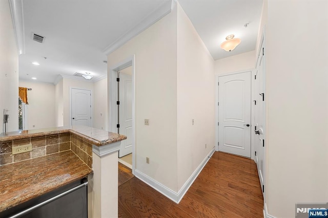 hall featuring recessed lighting, wood finished floors, visible vents, and baseboards