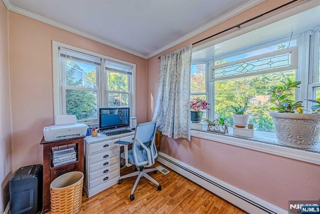 home office with a baseboard heating unit, light wood-type flooring, and crown molding