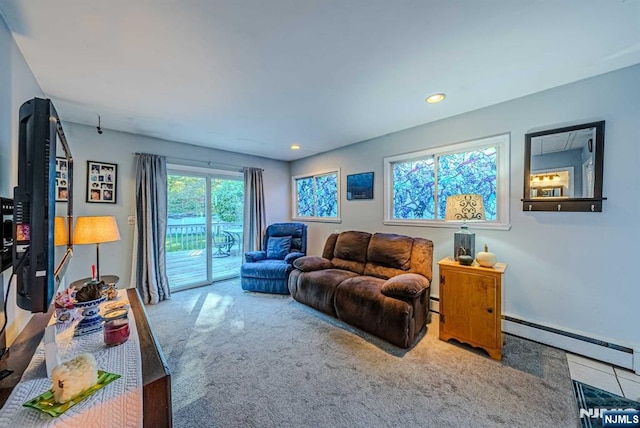 carpeted living room featuring a baseboard heating unit, baseboard heating, and recessed lighting