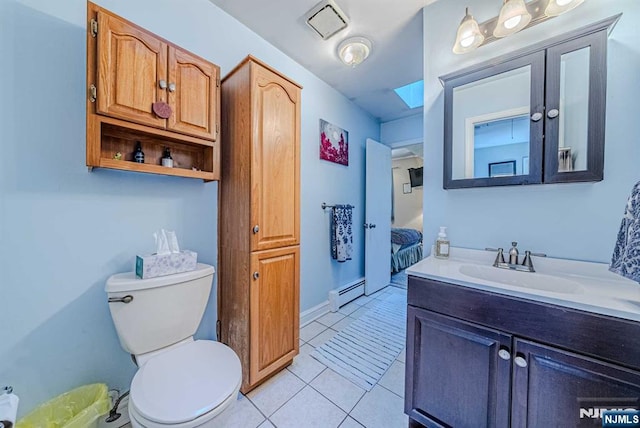 bathroom featuring tile patterned flooring, toilet, a baseboard heating unit, vanity, and visible vents