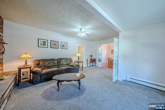 carpeted living room featuring arched walkways, a baseboard heating unit, and a ceiling fan