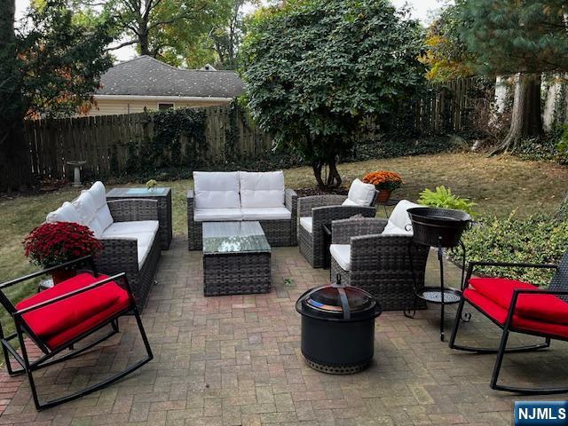 view of patio featuring a fenced backyard and an outdoor hangout area