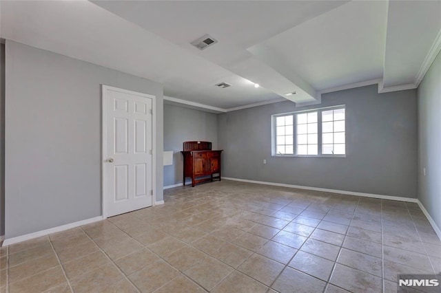 unfurnished room featuring light tile patterned floors, baseboards, visible vents, and ornamental molding