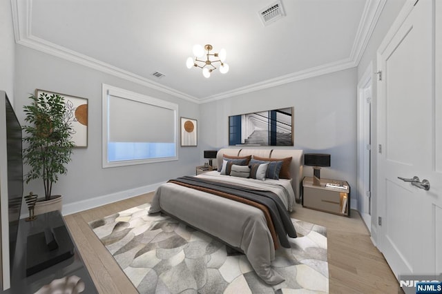 bedroom featuring light wood-style flooring, visible vents, and crown molding