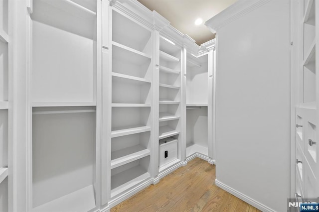 spacious closet with light wood-style floors