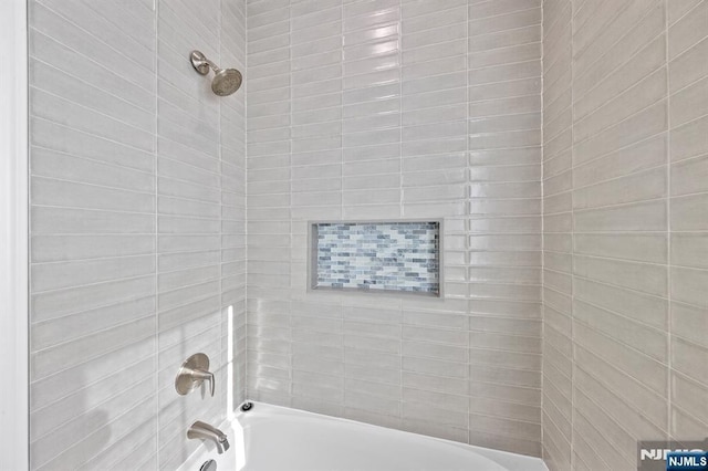 bathroom with shower / bathtub combination