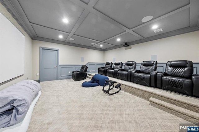 carpeted cinema room with recessed lighting, coffered ceiling, crown molding, and a decorative wall