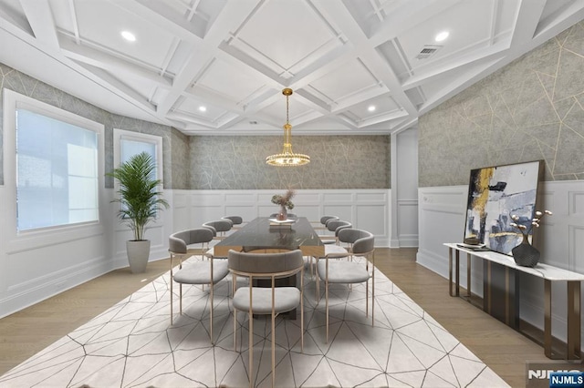 dining space with recessed lighting, coffered ceiling, wood finished floors, visible vents, and beam ceiling