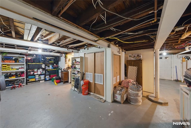 unfinished basement featuring visible vents