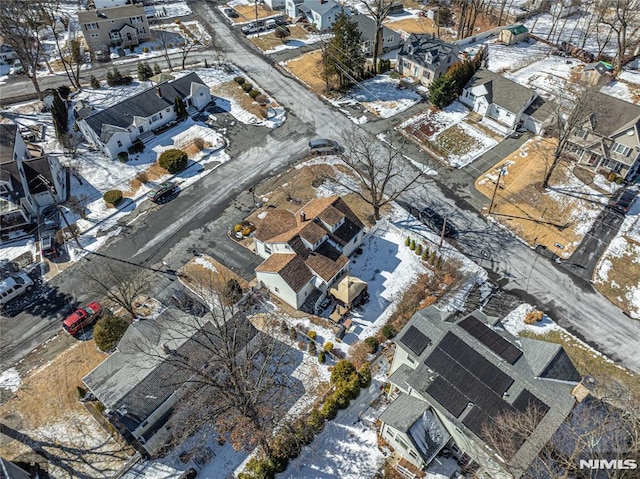 snowy aerial view featuring a residential view