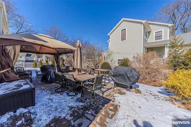 view of yard featuring outdoor dining space, fence, and a gazebo