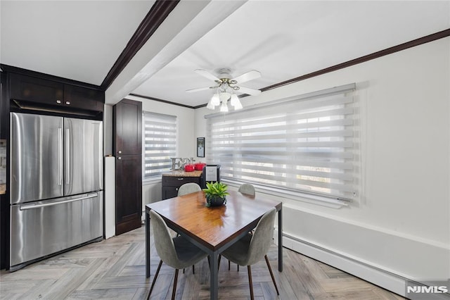 dining area featuring ceiling fan, ornamental molding, and a baseboard radiator