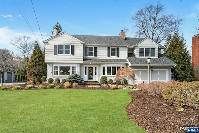 view of front of property with a garage, a front lawn, a chimney, and a shingled roof