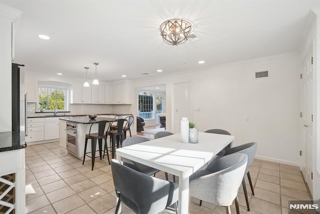 dining area featuring ornamental molding, recessed lighting, visible vents, and light tile patterned flooring