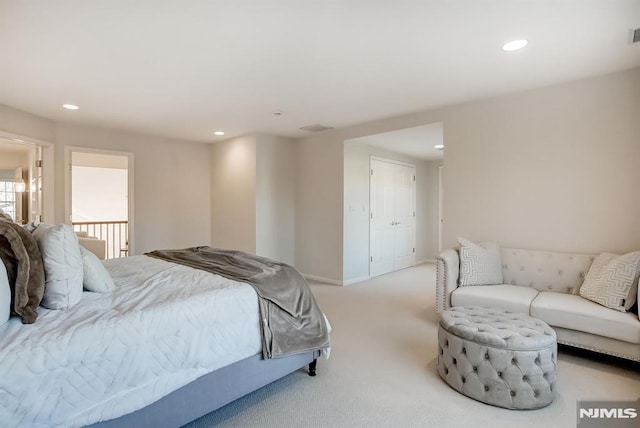 carpeted bedroom featuring baseboards, visible vents, and recessed lighting