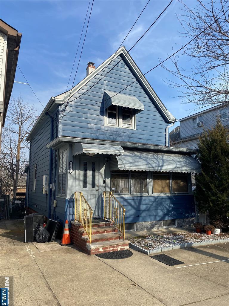 view of front of property featuring a chimney