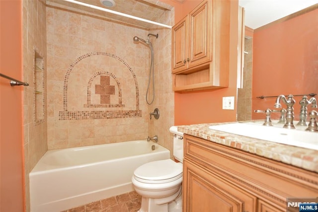 bathroom featuring shower / washtub combination, toilet, and vanity