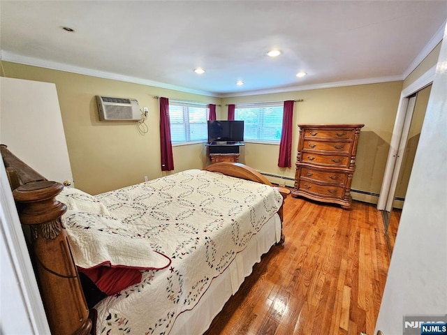 bedroom with recessed lighting, baseboard heating, ornamental molding, wood finished floors, and a wall mounted air conditioner