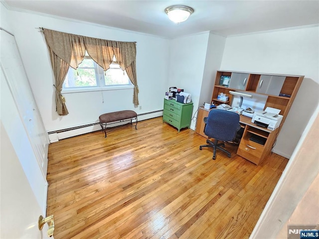 office area with light wood finished floors and ornamental molding