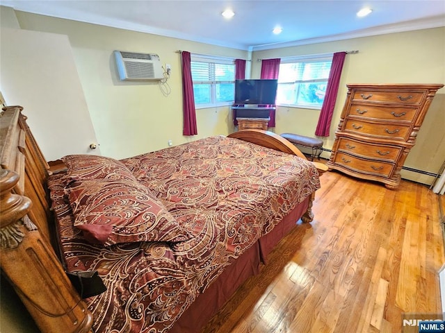 bedroom featuring ornamental molding, recessed lighting, an AC wall unit, and light wood finished floors