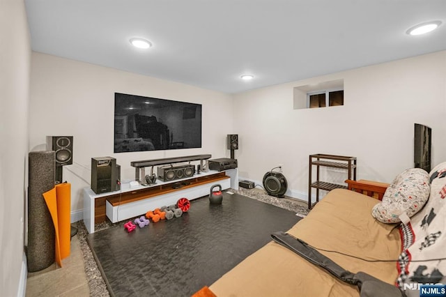 exercise area with baseboards and recessed lighting