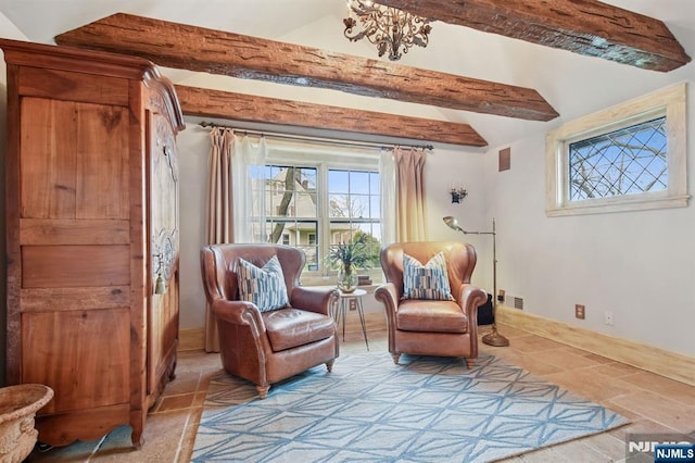 sitting room with lofted ceiling with beams and baseboards