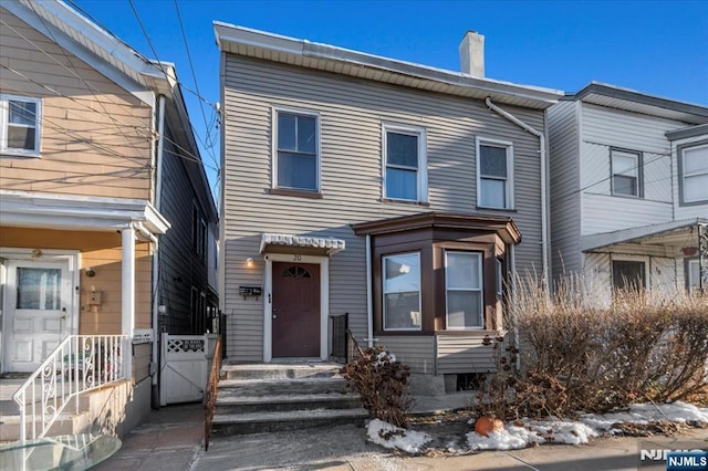 view of front of home with a chimney