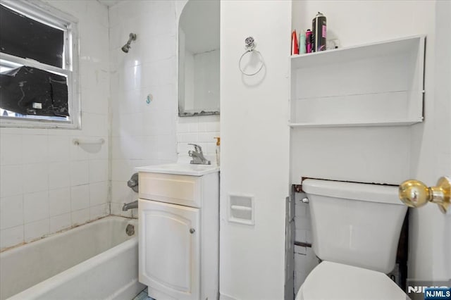 full bathroom featuring toilet, shower / tub combination, tasteful backsplash, and vanity