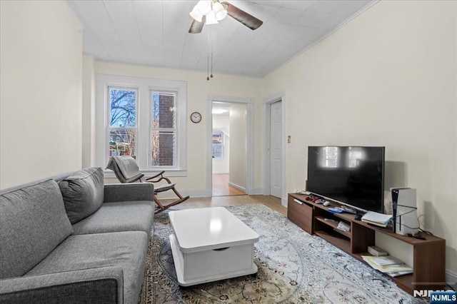 living area with ceiling fan