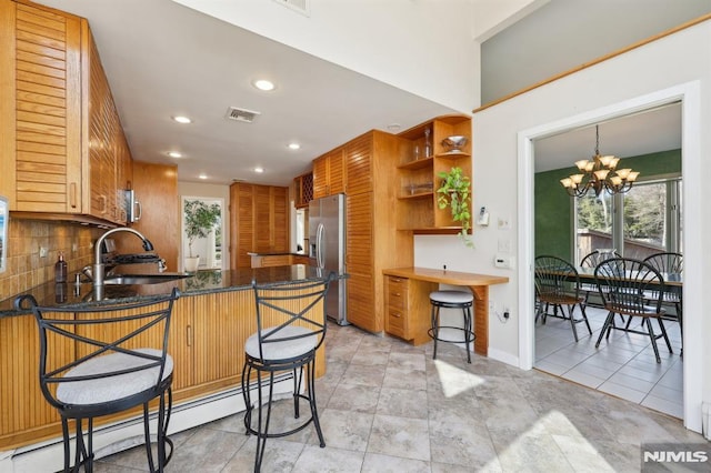 kitchen with open shelves, stainless steel fridge with ice dispenser, a baseboard radiator, decorative backsplash, and a sink