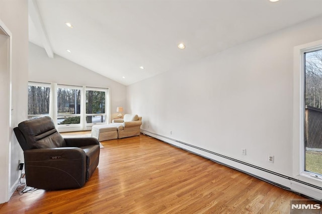 sitting room featuring recessed lighting, baseboard heating, light wood-style flooring, and high vaulted ceiling