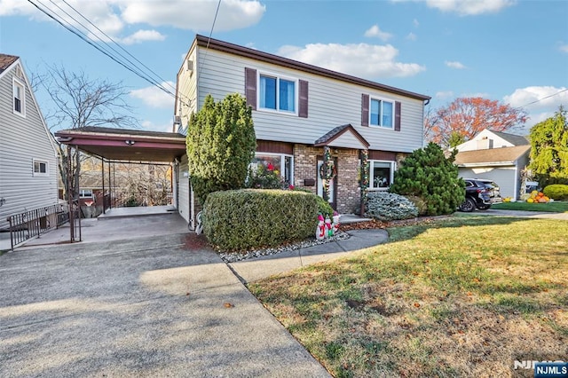 colonial home with a carport, brick siding, driveway, and a front lawn