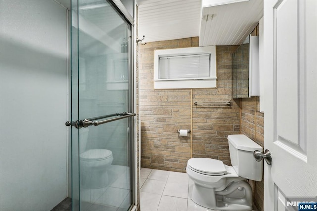 full bath with a stall shower, toilet, and tile patterned floors