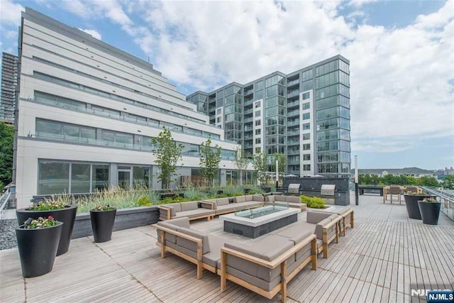 deck featuring an outdoor fire pit