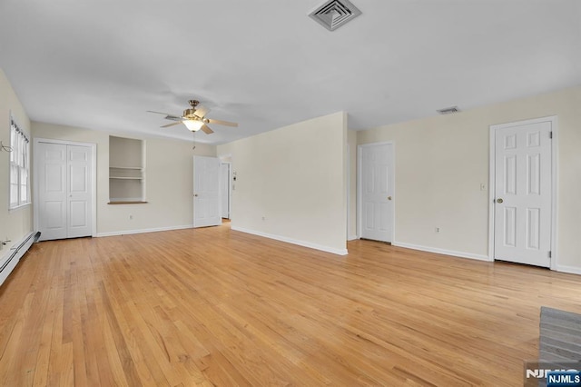 unfurnished living room featuring light wood-type flooring, visible vents, and ceiling fan