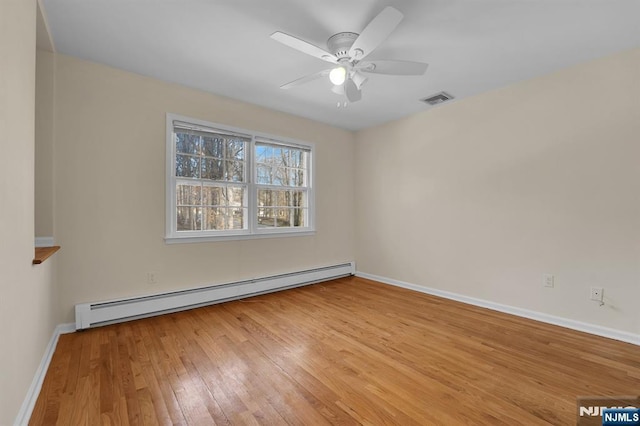 unfurnished room with a baseboard radiator, visible vents, ceiling fan, baseboards, and hardwood / wood-style flooring