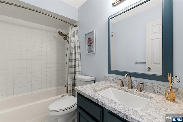 full bath with shower / bath combo, vanity, and toilet