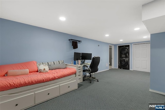 bedroom with stacked washer and dryer, recessed lighting, carpet floors, and baseboards