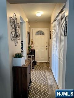 entryway featuring brick floor