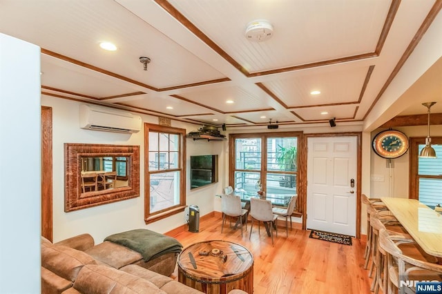 living area with light wood-style flooring, recessed lighting, coffered ceiling, ornamental molding, and a wall mounted AC