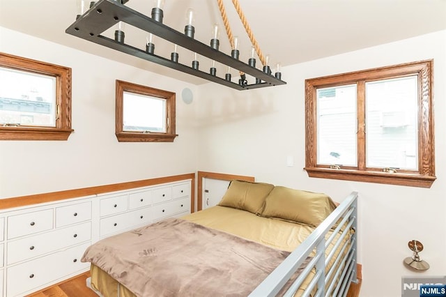 bedroom with wood finished floors