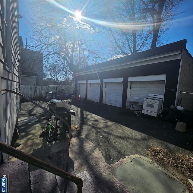 garage featuring fence