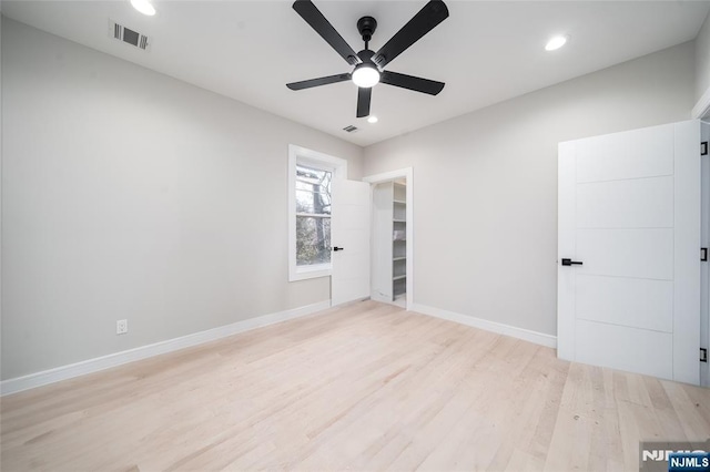 unfurnished room with ceiling fan, recessed lighting, visible vents, baseboards, and light wood-style floors