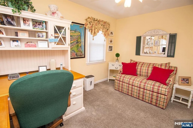 office space with baseboards, carpet floors, and built in desk